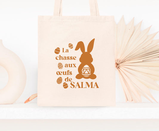 Mini tote bag Pâques personnalisé lapins et œufs pastels, petit sac chasse aux œufs en jute naturel avec prénom - Collection Pâques Mahelia Design