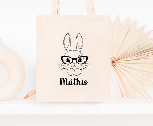 Mini tote bag Pâques personnalisé lapin et fleurs roses, petit sac chasse aux œufs en jute naturel avec prénom - Collection Pâques Mahelia Design