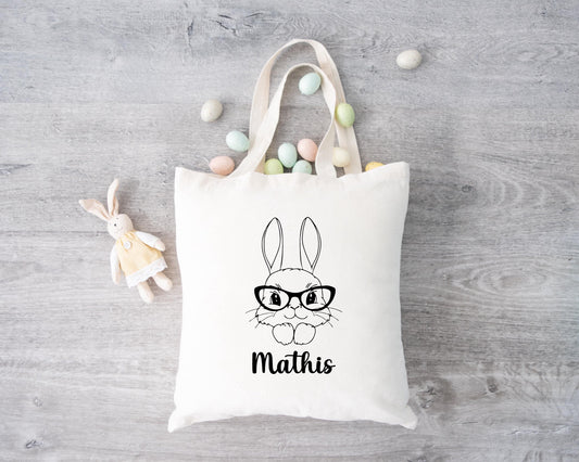 Tote bag Pâques personnalisé motif lapin et fleurs roses, sac chasse aux œufs en jute naturel avec prénom - Collection Pâques Mahelia Design