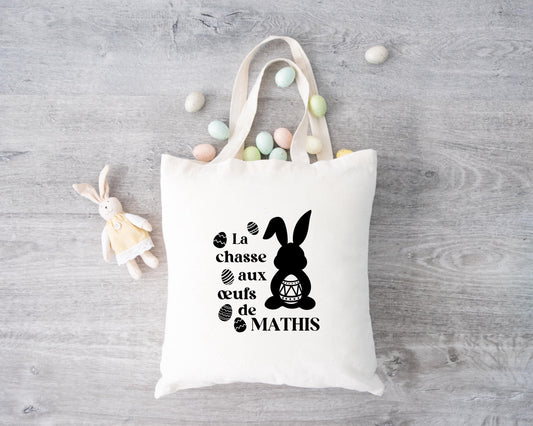 Tote bag Pâques personnalisé lapins et œufs pastels, sac chasse aux œufs en jute naturel avec prénom - Collection Pâques Mahelia Design