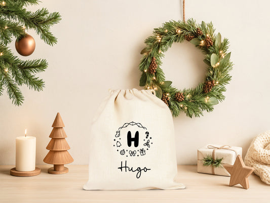 Pochon Noël Personnalisé Initiale Prénom | Hotte Père Noël Couronne Motifs Festifs | Sac Cadeau Coton Réutilisable | 5 Tailles